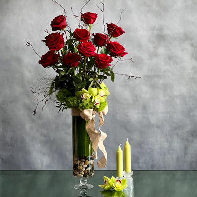 12 Roses Standing Tall arrangement with Ecuadorian long-stem roses and cymbidium orchids in a glass vase, available for same-day delivery by Beverly Hills Florist.