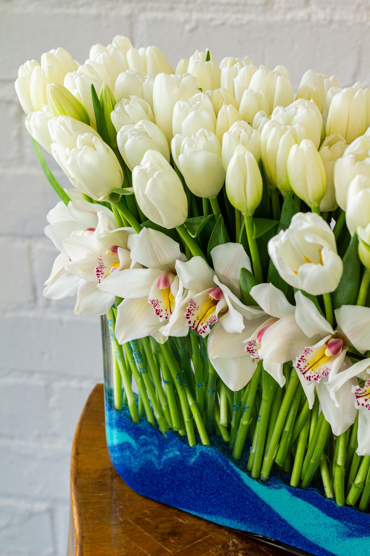 White Goddess - 150 White Tulips and Orchids