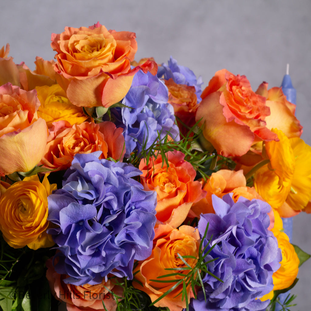 The Tale of Orange Roses and blue hydrangeas