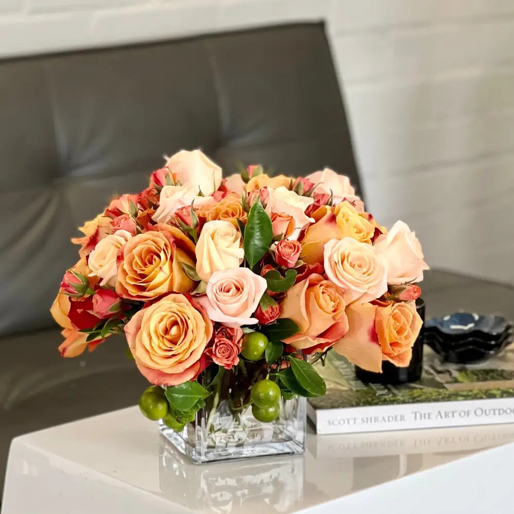 Blooms of Sunshine - Elegant Citrus Delight arrangement featuring vibrant flowers in a handcrafted 11-inch round design, perfect for brightening any space.