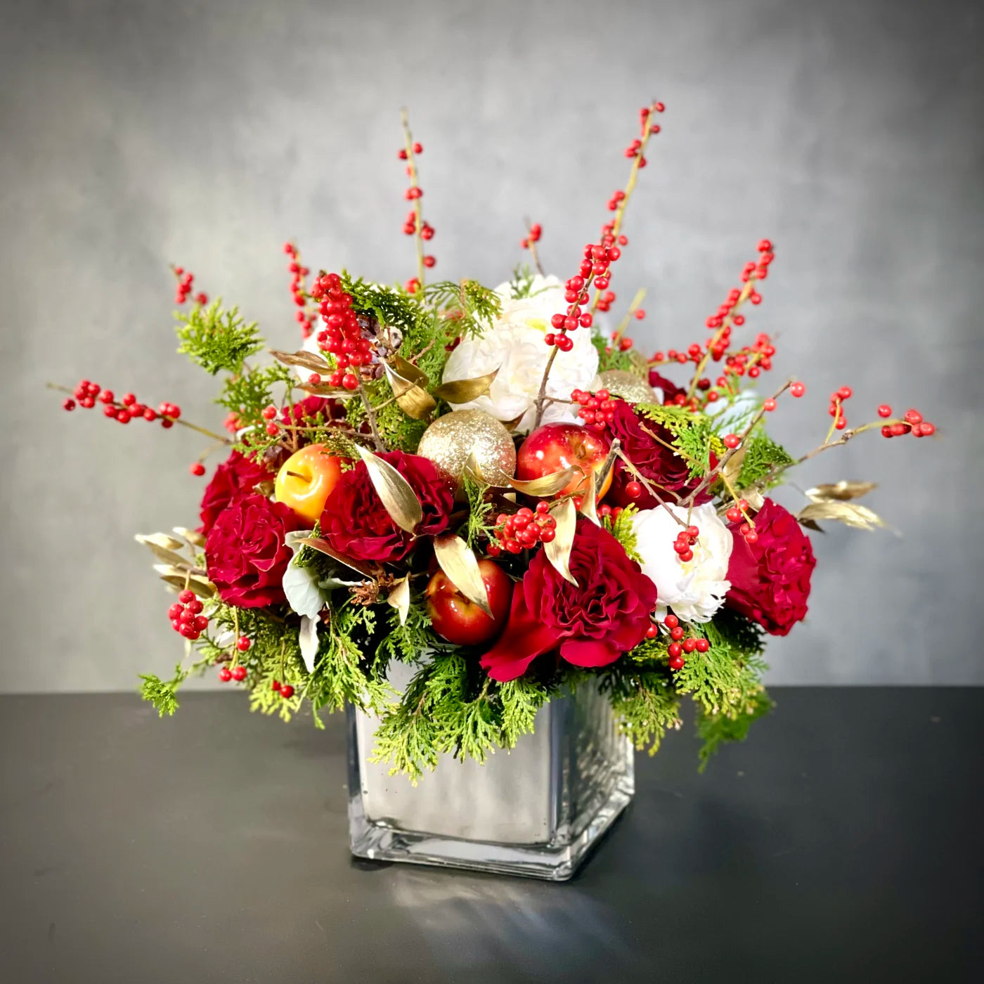 Designer Choice - Festive arrangement with vibrant holiday blooms, customizable with upgrades, available for same-day delivery by Beverly Hills Florist.