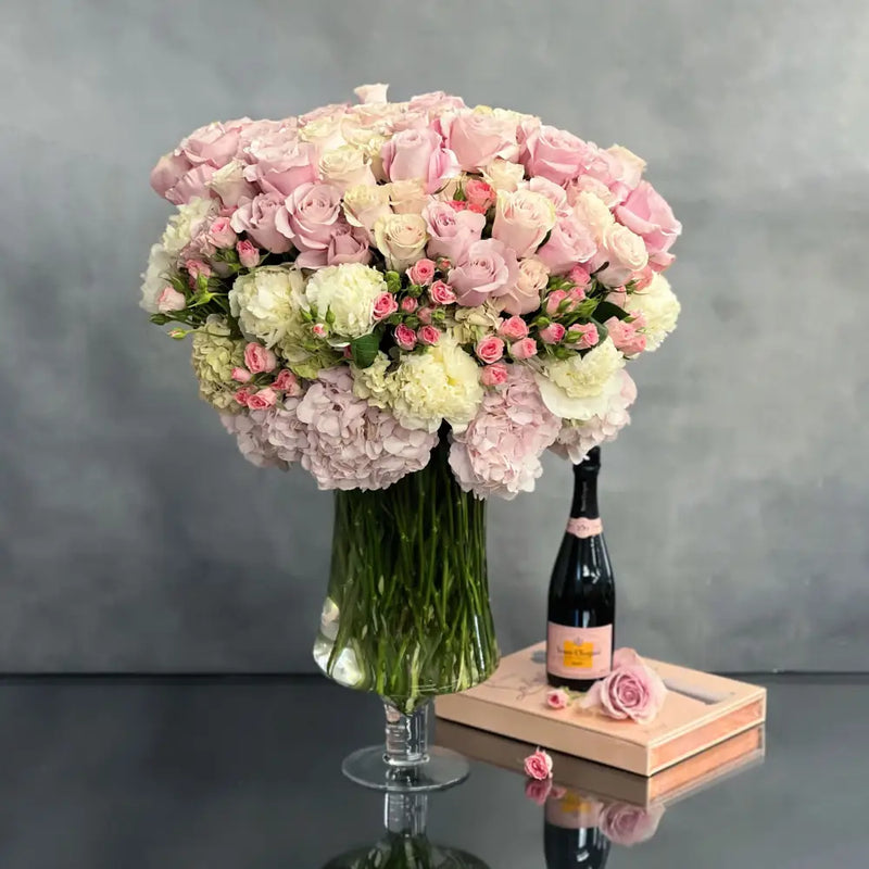 Elegant pink roses and peonies in a glass vase | Beverly Hills Florist