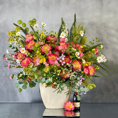 Grand floral arrangement with peonies, cosmos, and wild florals in a white ceramic vase – 4.5 feet tall, available for same-day delivery by Beverly Hills Florist.