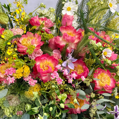 Grand floral arrangement with peonies, cosmos, and wild florals in a white ceramic vase – 4.5 feet tall, available for same-day delivery by Beverly Hills Florist.