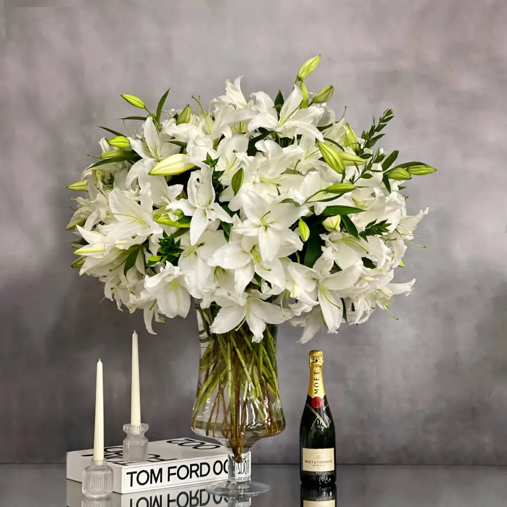 Tall long stem Casablanca lilies arranged in a glass vase with same-day delivery in Beverly Hills