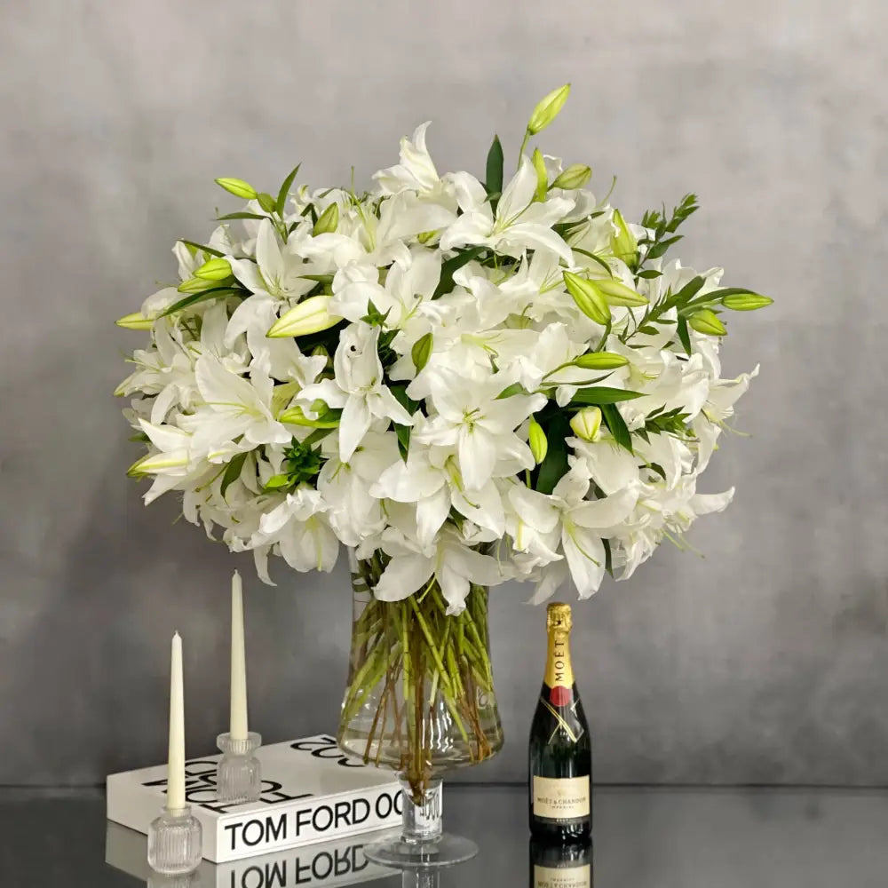 Tall long stem Casablanca lilies arranged in a glass vase with same-day delivery in Beverly Hills