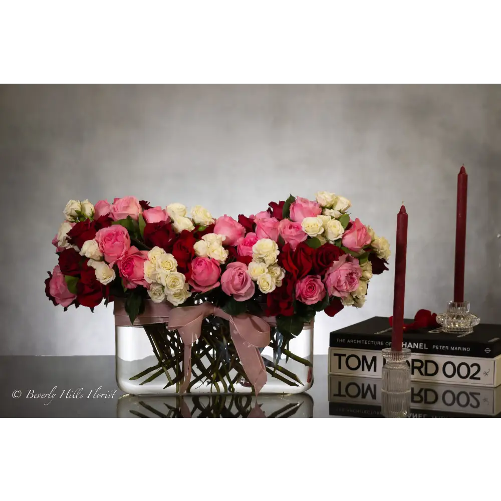 Luxury heart-shaped rose arrangement with over 100 premium red roses in a glass vase, available for same-day delivery in Beverly Hills and Los Angeles.
