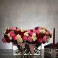 Luxury heart-shaped rose arrangement with over 100 premium red roses in a glass vase, available for same-day delivery in Beverly Hills and Los Angeles.