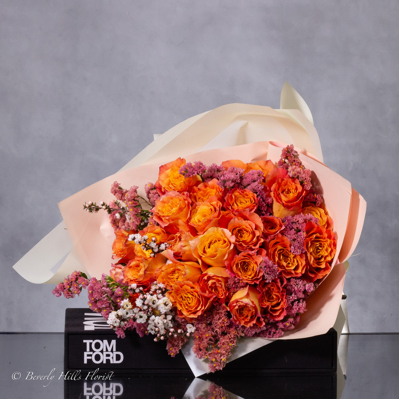 Orange Two-Tone Fragrant Rose Hand Bouquet with vibrant orange hues and delicate fragrance for same-day delivery in Beverly Hills.