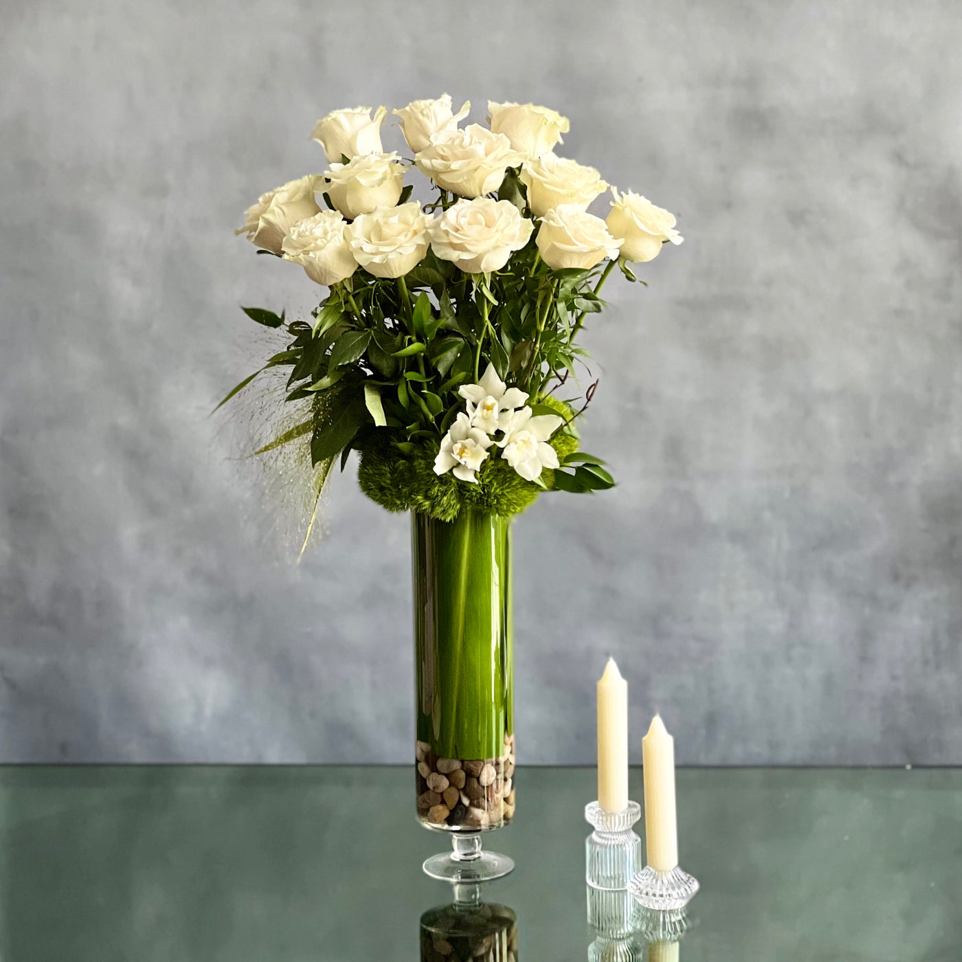 12 White Long Stem Roses Standing Tall arrangement with Ecuadorian long-stem roses and cymbidium orchids in a glass vase, available for same-day delivery by Beverly Hills Florist.