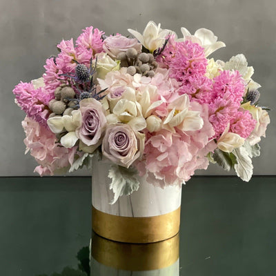 A full, fluffy, fragrant arrangement filled with lovely pastel hyacinths and lavender roses. Beverly Hills Florist presents Powder puff for same day delivery ! Powder pink Hydrangeas add fullness while accent florals sprinkle in additional colors. This arrangement is perfect for everyday or a special day.