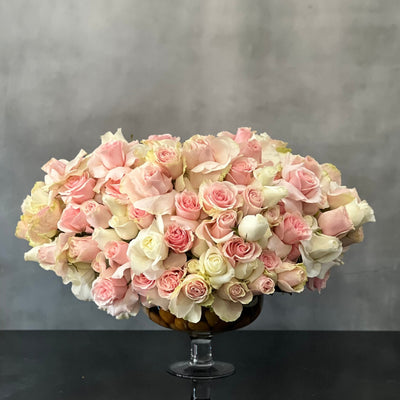 Designed to be the ultimate expression of your affection our team at Beverly Hills Florist can arrange our Passion in Pink for same day delivery. In our floral piece we have over 100 stems of Light Pink and white South American Roses are exquisitely arranged in a container. This is sure to leave an impression that's impossible to forget! A notion of sincerity making it wonderful for love and romance, thinking of you, congratulations, welcomes and more ! 