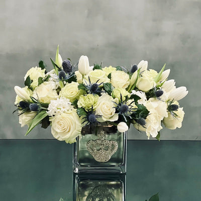 Beverly Hills Florist presents a variety of White Roses and Tulips, accented with Thistles in a silver vase. Made sure to shine with its bejeweled  crown ! Available for same day delivery. Making it a perfect fit for Love and Romance, Birthday or a thank you !  