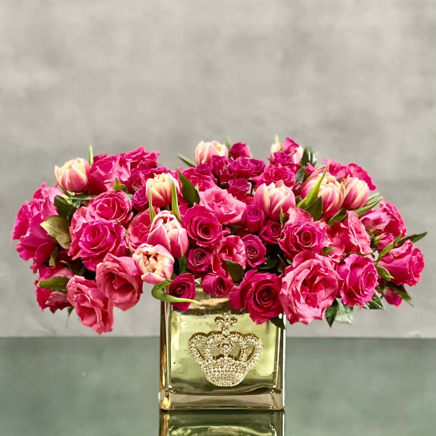 Beverly Hills Florist presents Sweet Mom of Mine for same day delivery ! A cluster of pink tulips and roses in a bejeweled crown gold glass vase. A beautiful notion of Love and Romance. 