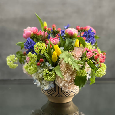 Beverly Hills Florist presents same day delivery for our Designers Choice - Spring. Let one of our talented designers put together a spring arrangement with seasonal flowers. This is a mix of vibrant summer flowers in a ceramic vase that is approximately 10" round. A beautiful notion of summer flower, thinking of you and a congratulations! 
