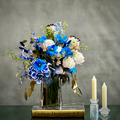 When your Monday's are feeling rather blue. Why not try this quiet little bouquet from  Beverly Hills Florist to bring a bit of serenity into your week with same day delivery service. This sure to never disappoint, these wonderful selections of blues tulips, white peonies, and white king protea are there to brighten even the gloomiest of days.