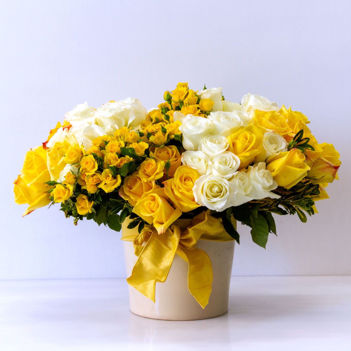 Our team at Beverly Hills Florist presents over 75 Ecuadorian Roses and locally grown spray Roses in a Ceramic Vase for same day delivery! Our Ms.Clueless is available for same day delivery! A bright and cheerful floral piece made for Birthdays, Thank you, Thinking of you and more !