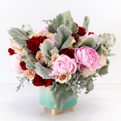 My Beverly Hills florist presents a vibrant and eye catching design that will light up any space with 1 Dozen of pink Peonies, accented with sand color and burgundy Heart Roses, create a lovely accent amongst the delicate shades of pink and approximately 18" tall and 18" wide with a beautiful ceramic container. Our Pink and Red Paradise is now available for same day delivery ! 