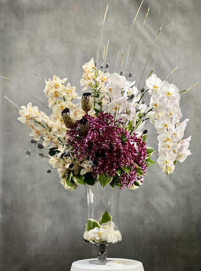 Beverly hills Florist presents Orchid bliss for same day delivery.. This piece includes, various white Orchids, Purple Phalaenopsis Orchids. Perfect for for Welcome flowers, extravagant events, Birthday flowers and more!  