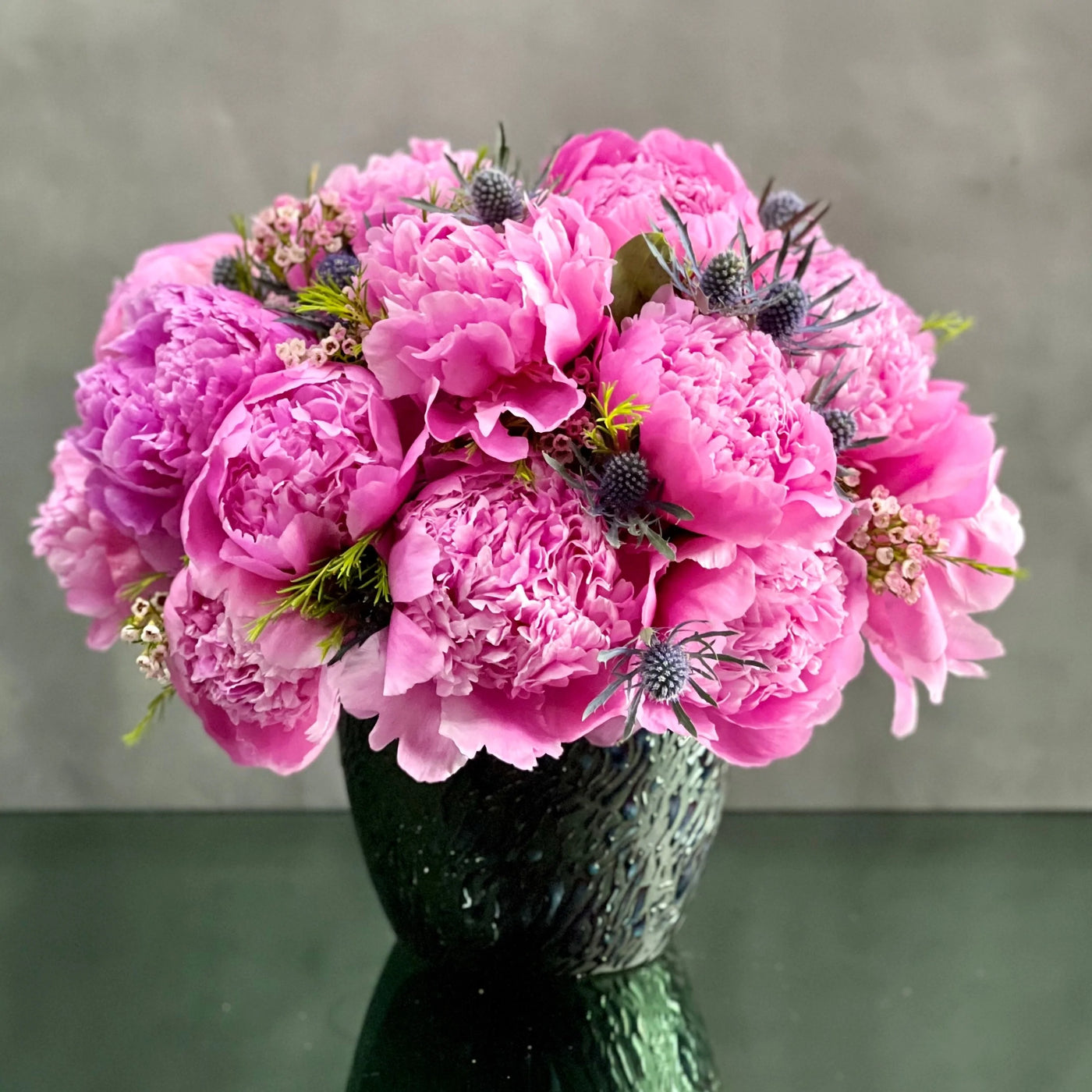 Full, fluffy, fresh, and gorgeous! Our team at Beverly Hills Florist presents Peonies Singing the Blues for same day delivery! These delicate coral Peonies can stand alone and make a huge statement of their own. A beautiful gesture for birthday, anniversary, love and romance and a thank you! 