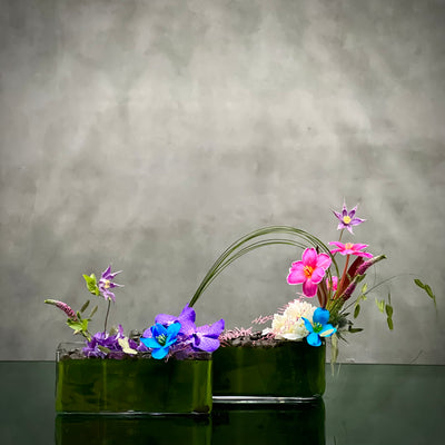 Beverly Hills Florist Presents same day delivery for our Love at First Sight. This includes Pink and Blue Tulips, Purple Vanda Orchids placed in a modern glass vase !
