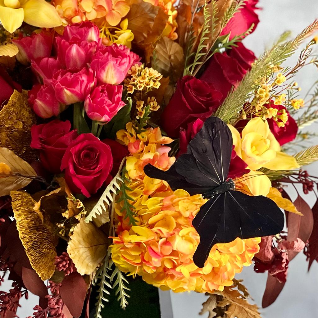 Autumn Sonata arrangement with local hydrangeas, South American roses, and Asian orchids in vibrant fall colors, available for same-day delivery by Beverly Hills Florist.