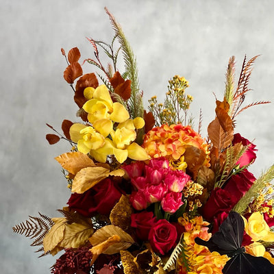 Autumn Sonata arrangement with local hydrangeas, South American roses, and Asian orchids in vibrant fall colors, available for same-day delivery by Beverly Hills Florist.