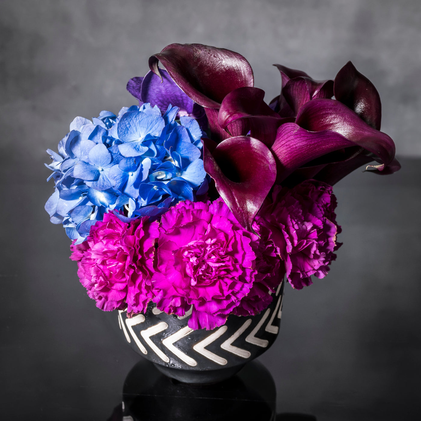 Blue Moonlight arrangement with blue, purple, and pink specialty flowers, available for same-day delivery by Beverly Hills Florist.