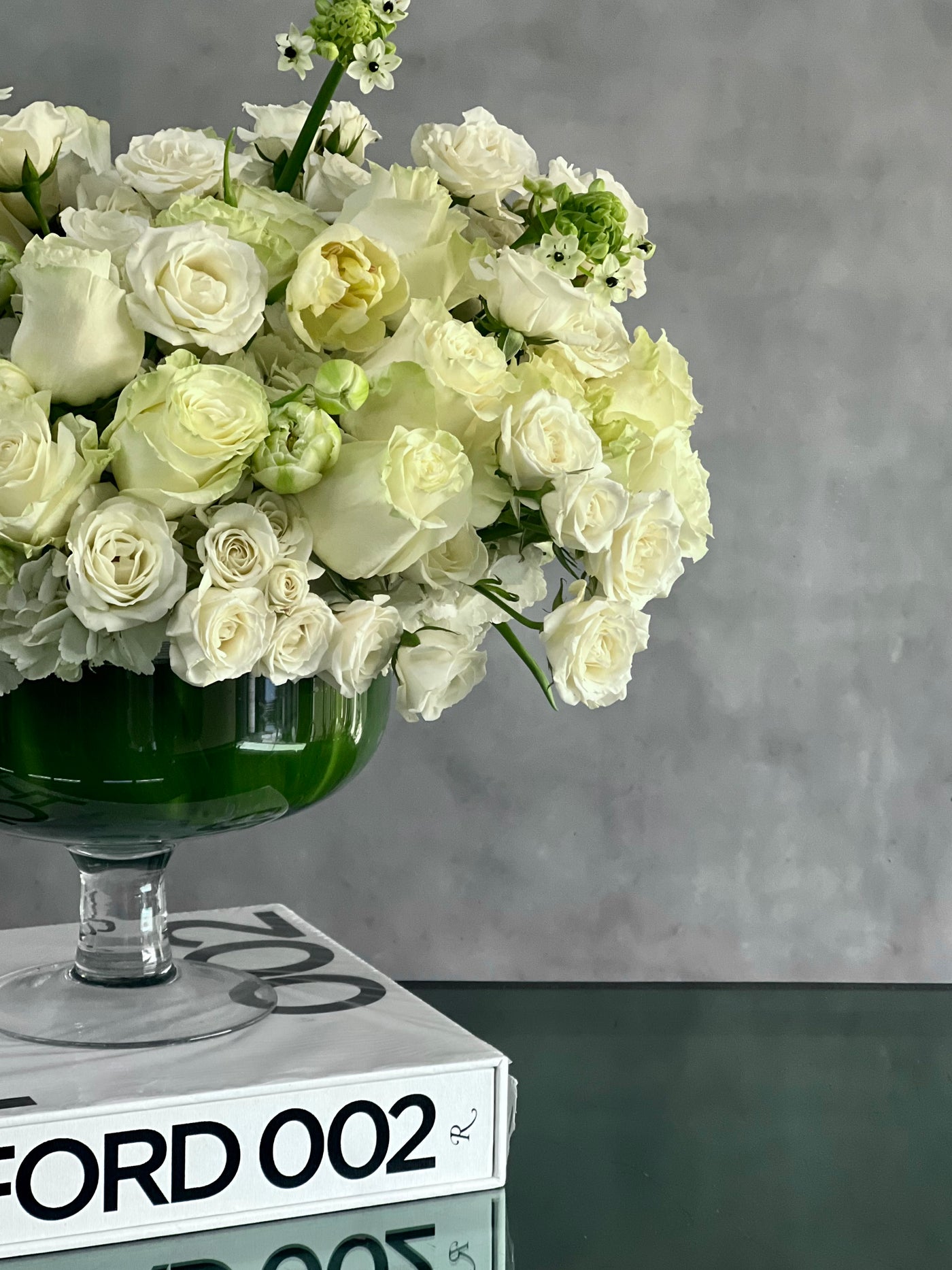 Capture The Heart arrangement with white roses and seasonal flowers in a pedestal vase, available for same-day delivery by Beverly Hills Florist.