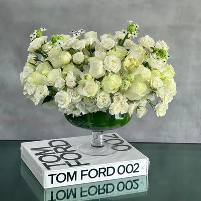 Capture The Heart arrangement with white roses and seasonal flowers in a pedestal vase, available for same-day delivery by Beverly Hills Florist.