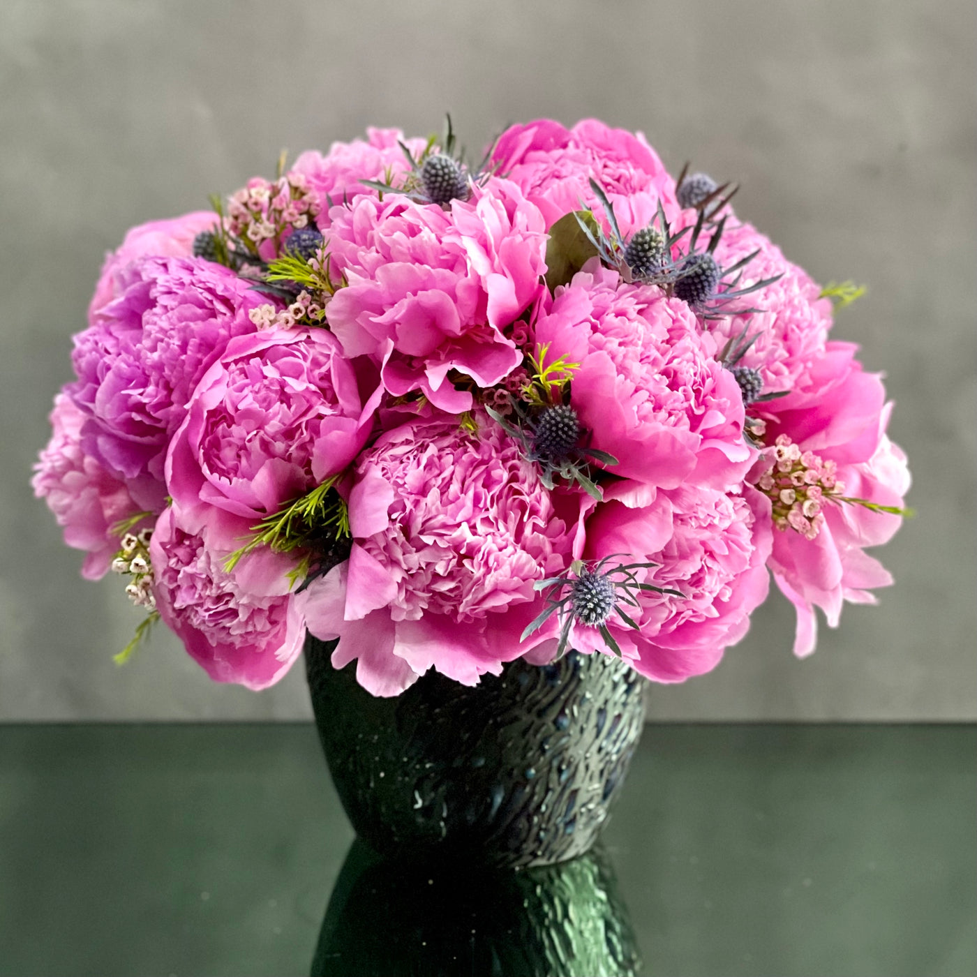 Pink Peony Bliss arrangement featuring full, fresh pink peonies in a ceramic container, perfect for elegant gifting or home décor, same-day delivery Beverly Hills.