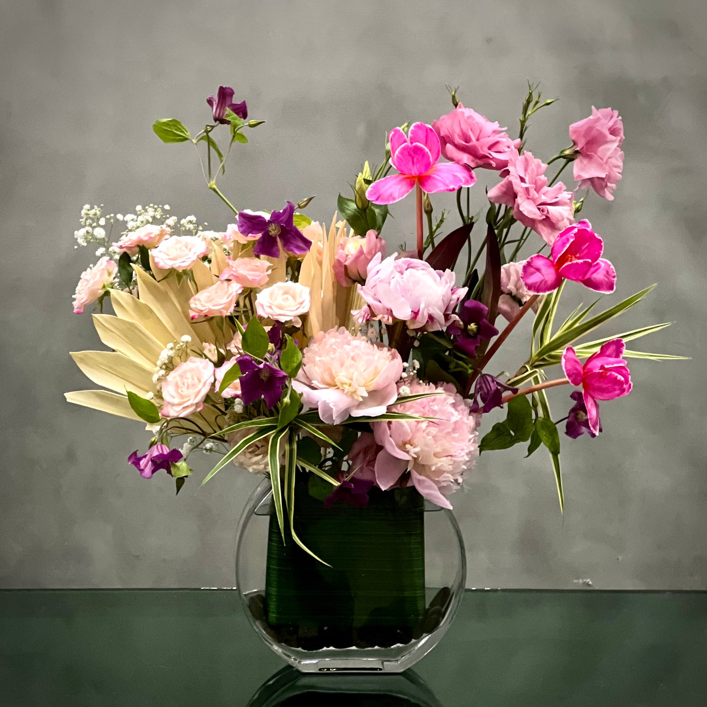Beverly Hills Florist presents Modern Garden for same day delivery !  Includes Pink Tulips, Pink Peonies, Pink Baby Roses and various blooms. Get well soon flowers, summer flowers, love and romance flowers, welcome home flowers